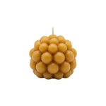 Beeswax bubble candle on a white background