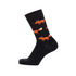 Black sock with orange fox patterns on a white background