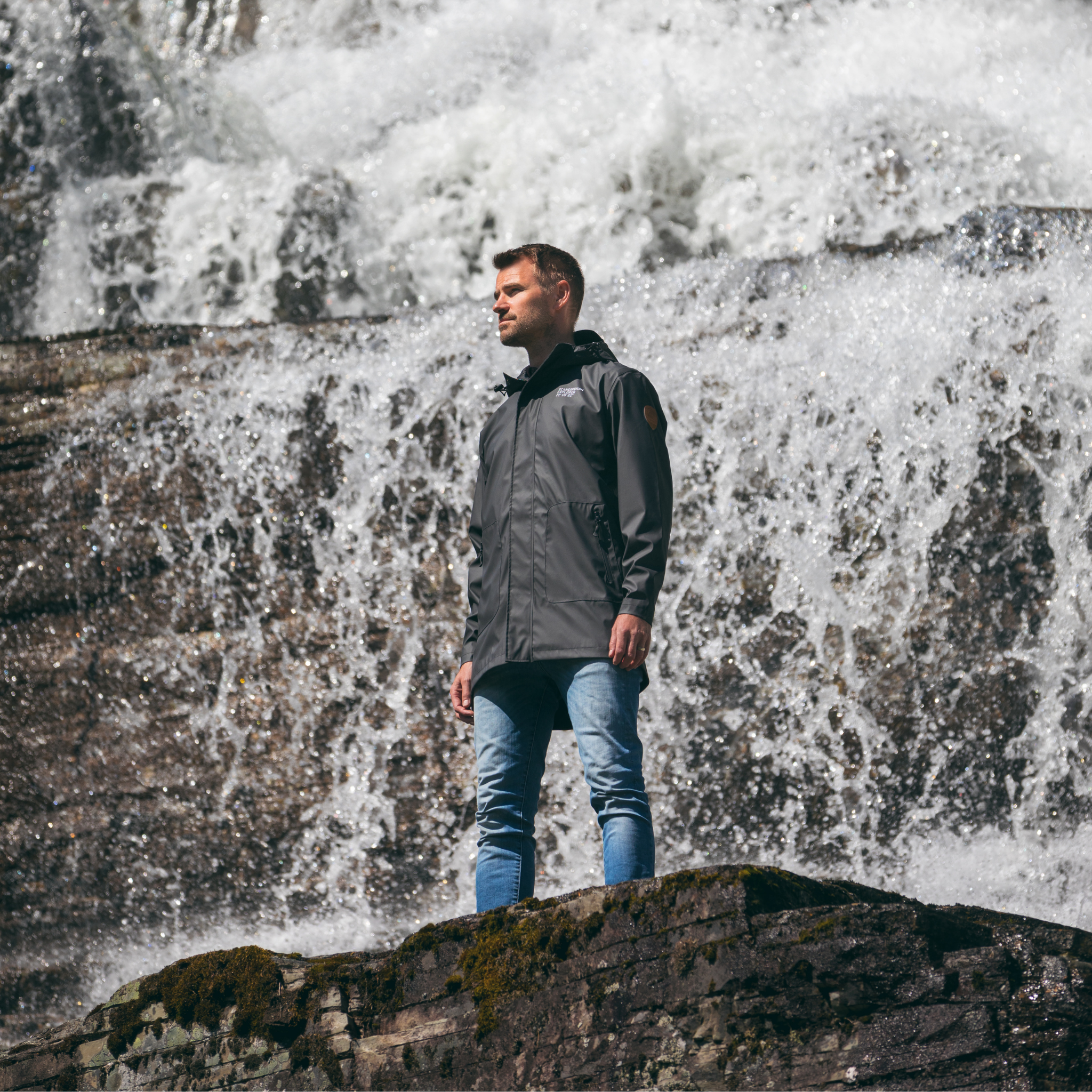 mens scandinavian raincoat lifestyle waterfall